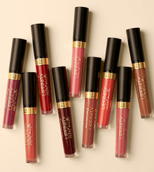 Max Factor Lipfinity Velvet Matte Lip Gloss in shade 040 Luxe Nude, a long-lasting liquid lipstick with a soft velvet matte finish in a warm nude tone, presented in a sleek transparent tube with a black cap.