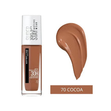 Close-up of Maybelline SuperStay 24H Foundation in shade 70 Cocoa showcasing the pump applicator and creamy liquid foundation texture.