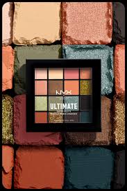 Open NYX Professional Makeup Ultimate Shadow Palette Ultimate Utopia showcasing an assortment of matte and shimmer eyeshadow shades for versatile eye looks.